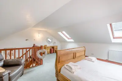 a bedroom with a bed and a couch at 1 Bed in Troutbeck oc-l32563 in Troutbeck