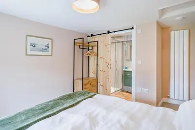 a white bedroom with a bed and a window at 2 Bed in Ormathwaite oc-s32385 in Applethwaite
