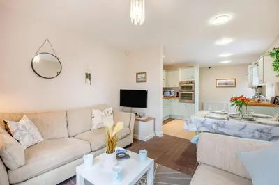 a living room with a couch and a table at 2 Bed in Aspatria oc-p32645 in Aspatria