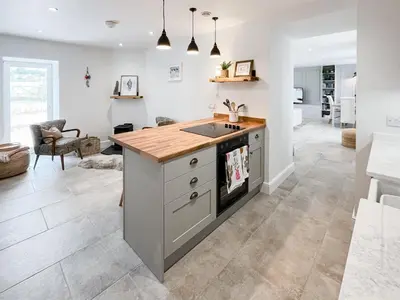 a kitchen with a sink and a counter at The Old Coach House At Balcary in Auchencairn