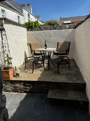 a patio with two chairs and a table on a patio at Number 26 in Portpatrick