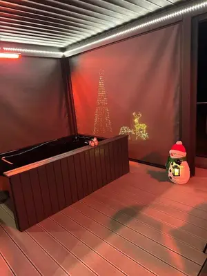 a room with a wall with a christmas tree on it at Hamish's Hideaway in Eaglesfield