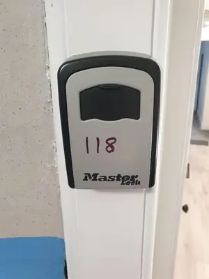 a door with the number on it at Modern Two-Bedroom Apartment Near River with Free Parking & WiFi in Dumfries
