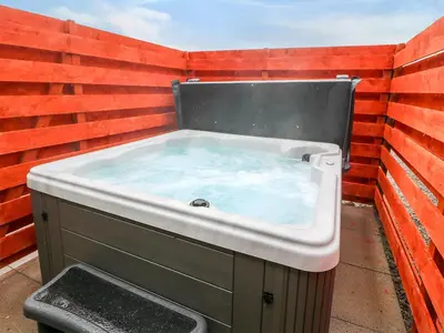 a jacuzzi tub sitting on the side of a wall at The Barn in Girthon