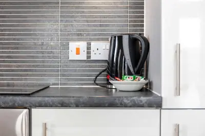 a mixer sitting on a counter in a kitchen at The Portland Penthouse - Donnini Apartments in Troon
