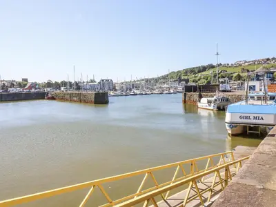 a view of a river with boats docked at Keekle Terrace in Cleator Moor