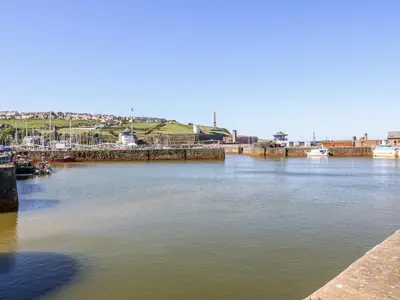 a view of a river with boats in it at Lowther House in Whitehaven