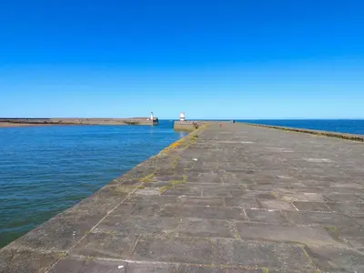 a pier stretches out into the water at Lowther Penthouse in Whitehaven
