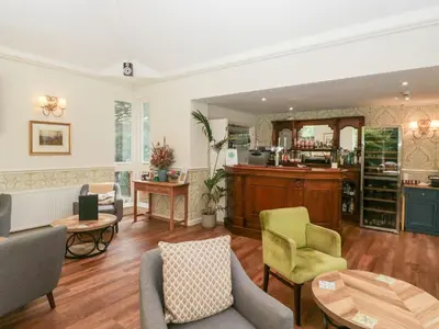a living room with chairs and a table at Dorothy in Ambleside