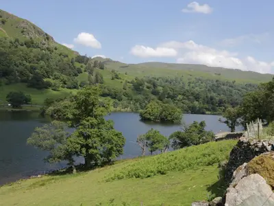 a view of a lake in the hills at Dorothy in Ambleside