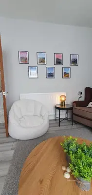 a living room with a white couch and a table at Ample town house in Workington, West Lakes, Lake District in Workington