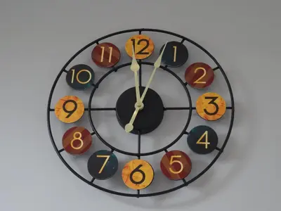 a clock withoc numerals on it on a wall at Lazy Lodge in Foxdale