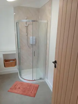 a shower with a glass enclosure in a bathroom at Double Ensuite - City centre homestay - Peterill Room - in Carlisle