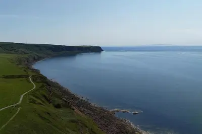 an aerial view of a large body of water at Coastal Haven - Steps From Beach in Whitehaven