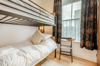 a bedroom with a bunk bed and a window at 2 Bed in Cockermouth oc-m32942 in Cockermouth