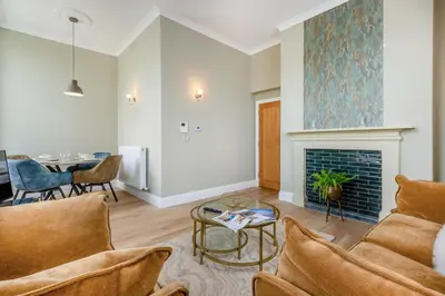 a living room with a couch and a fireplace at 2 Bed in Cockermouth oc-m32942 in Cockermouth