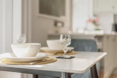 a table with plates and a wine glass on it at 1 Bed in Cockermouth oc-h32941 in Cockermouth