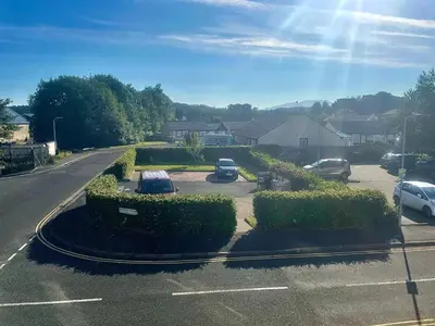 a street with cars parked in a parking lot at 1 Bed in Cockermouth oc-h32941 in Cockermouth