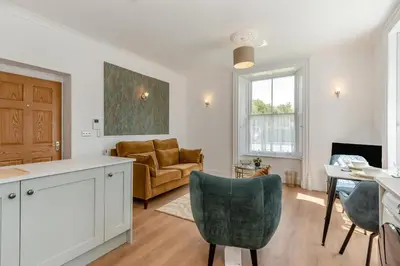 a kitchen and living room with a couch and a table at 1 Bed in Cockermouth oc-h32941 in Cockermouth