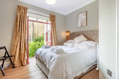 a bedroom with a large white bed and a window at 1 Bed in Cockermouth oc-h32941 in Cockermouth