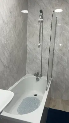 a bathroom with a shower and a sink at QueensBerry accommodation in Annan