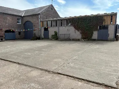 an empty parking lot in front of a building at Hillside Farm in Carlisle