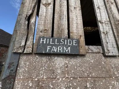 a sign that says hillside farm on the side of a building at Hillside Farm in Carlisle