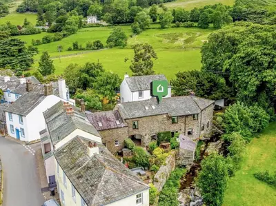 an aerial view of an old house with a green number four at 4 Bed in Cockermouth oc-sz098 in Lorton