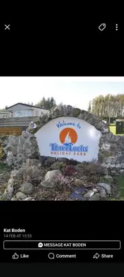 a sign for aessee act house on a stone wall at Three lochs holiday park Loch view 123 in Balminnoch