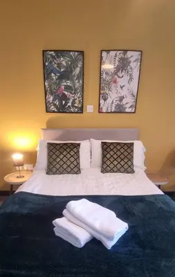 a bedroom with a bed with two towels on it at Studio No4, Cockermouth The Lakes in Cockermouth