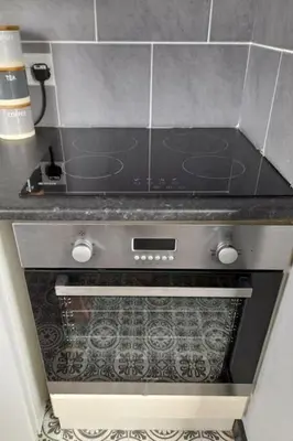 a stove top oven sitting in a kitchen at Studio No4, Cockermouth The Lakes in Cockermouth