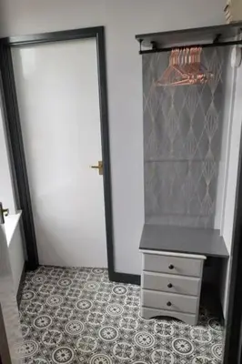 a closet with a door and a dresser in a room at Studio No4, Cockermouth The Lakes in Cockermouth
