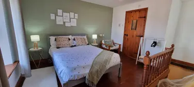 a bedroom with a bed with a blue comforter at The Creamery High Harrington in Harrington