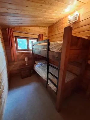 a bedroom with two bunk beds in a log cabin at 87 Loch Murray in Creetown