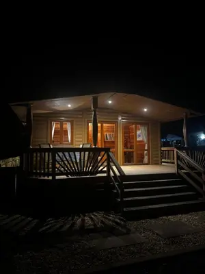 a house at night with the lights on at 87 Loch Murray in Creetown