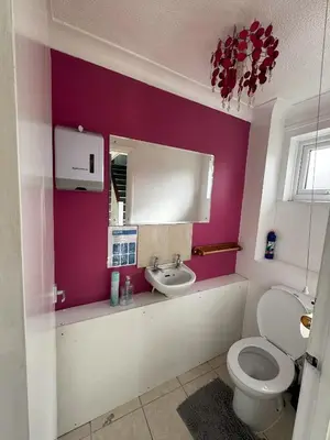 a bathroom with a toilet and a sink at Honey House in Moffat