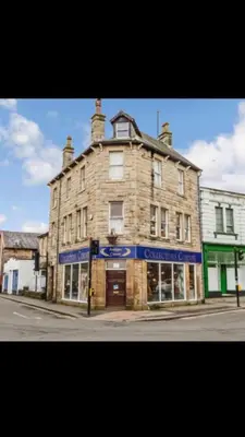 an old stone building on the corner of a street at Studio No5, Cockermouth The Lakes in Cockermouth