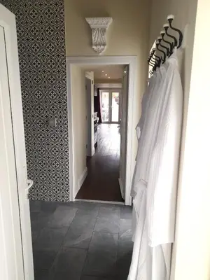 a hallway with a hallway leading into a room with a hallway at Kirkcudbright Holiday Apartments - Apartment B in Kirkcudbright