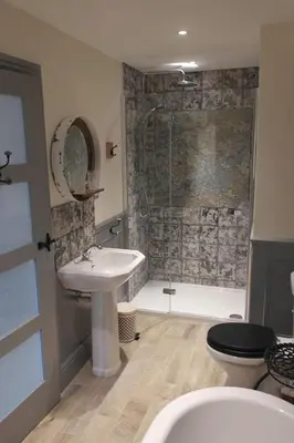 a bathroom with a sink and a toilet and a shower at The Little Inn at Grasmere in Grasmere