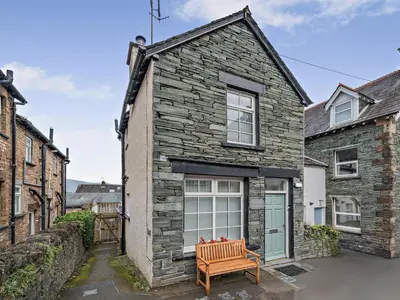 a stone house with a bench in front of it at 1 Bed in Keswick 96314 in Keswick