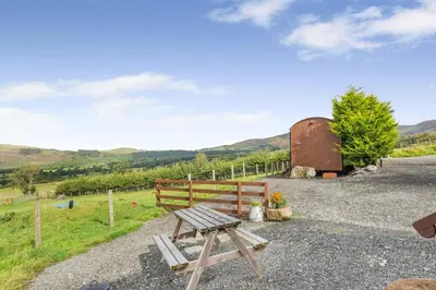 a picnic table in front of a barn at 1 Bed in Keswick oc-c33119 in Bassenthwaite