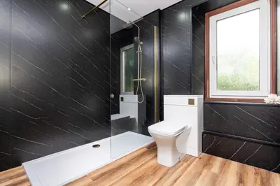 a bathroom with a toilet and a shower at 2Bedroom House - Free Parking- by Holiday Homes in Annan