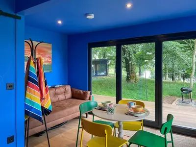 a living room with a couch and a table and chairs at Cassiopeia - Uk50360 in Castle Douglas