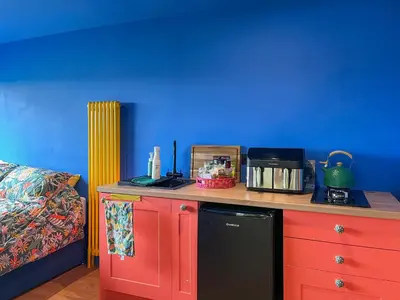 a kitchen counter with a black dishwasher on top of it at Cassiopeia - Uk50360 in Castle Douglas