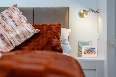a bedroom with a bed with a pillow and a table at 1 Bed in Wetheral oc-r32933 in Wreay