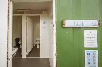 a small bathroom with a toilet in a room at Unit 3 - High Pike View Camping Pod in Carlisle