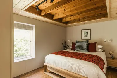 a bedroom with a large bed and a window at The Hideaway at Yew Trees, Ullswater in Watermillock