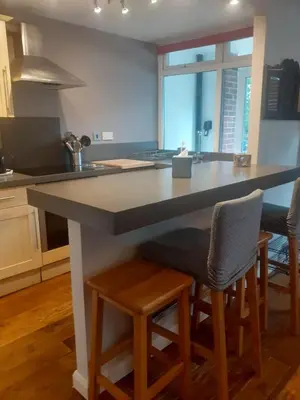 a kitchen with a large island in the middle at 2 new bold lawns leamington spa in Moffat
