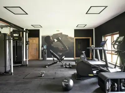 a gym with a painting of a woman on the wall at Landal Whitbarrow in Penruddock
