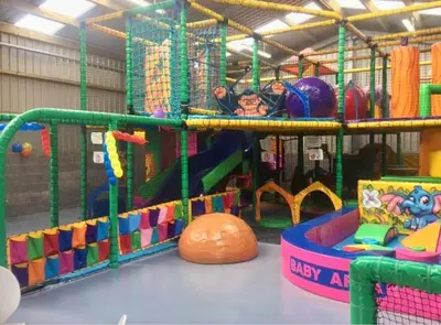 a childrens play room with a playground with many toys at Loch View 30 in Stranraer